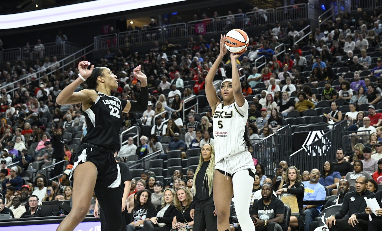 Angel Reese shooting over A'ja Wilson